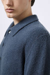 Polo aus Merino-Bouclé-Wolle