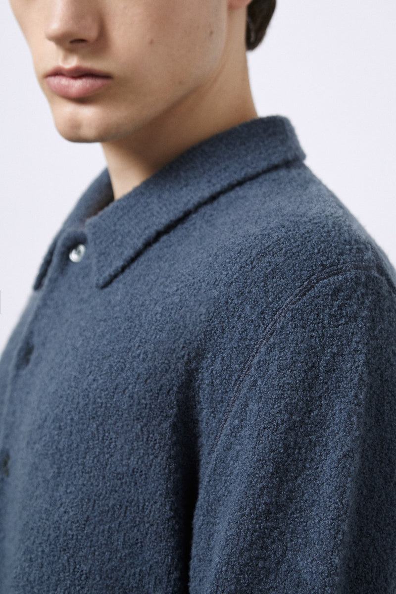 Polo aus Merino-Bouclé-Wolle
