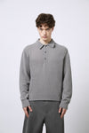 Polo aus Merino-Bouclé-Wolle