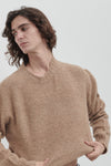 Brushed crew neck in buttoned Merino wool
