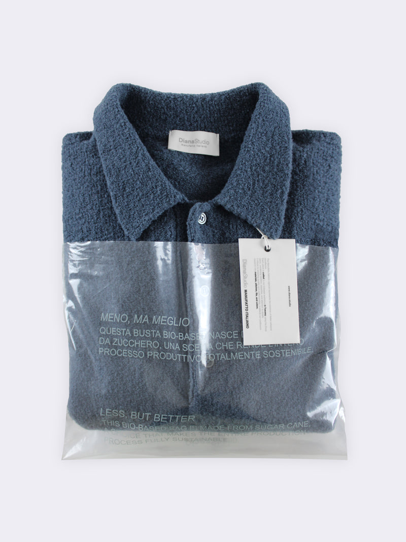 Polo aus Merino-Bouclé-Wolle