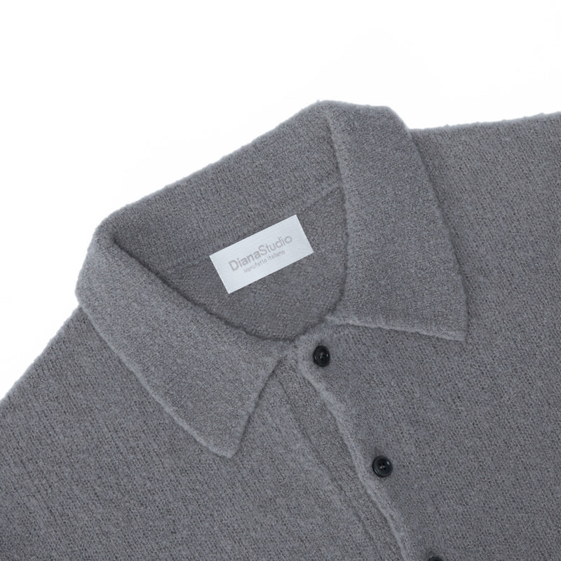 Polo aus Merino-Bouclé-Wolle