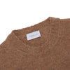 Brushed crew neck in buttoned Merino wool