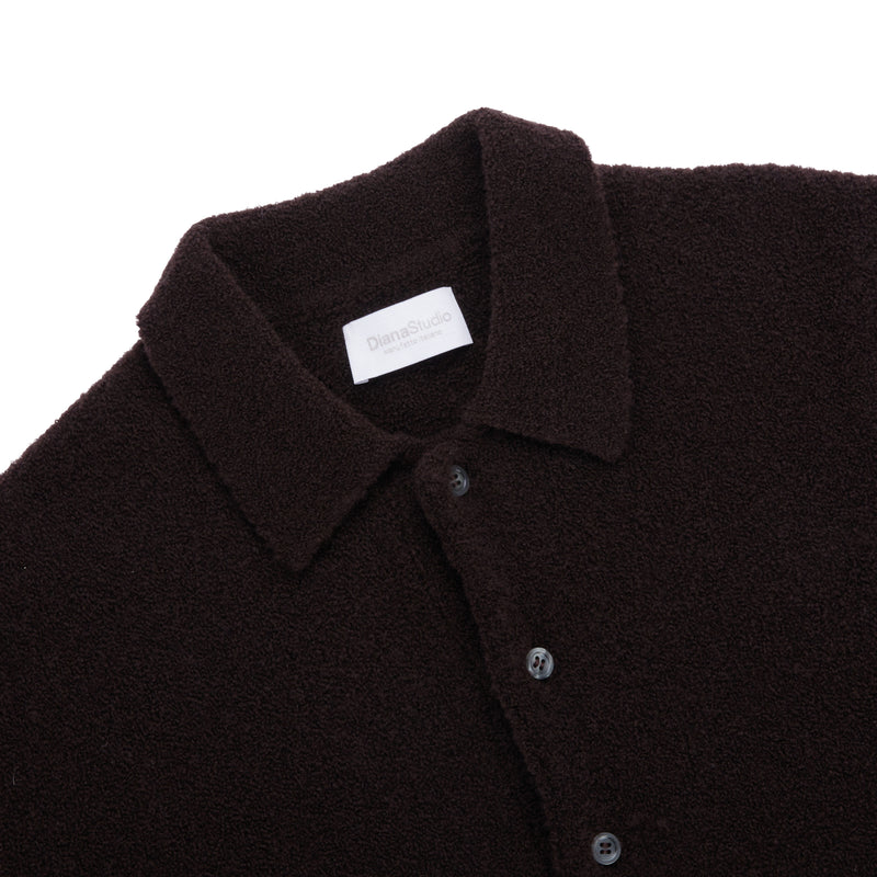 Polo aus Merino-Bouclé-Wolle